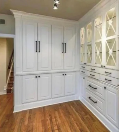 an empty room with windows and closet