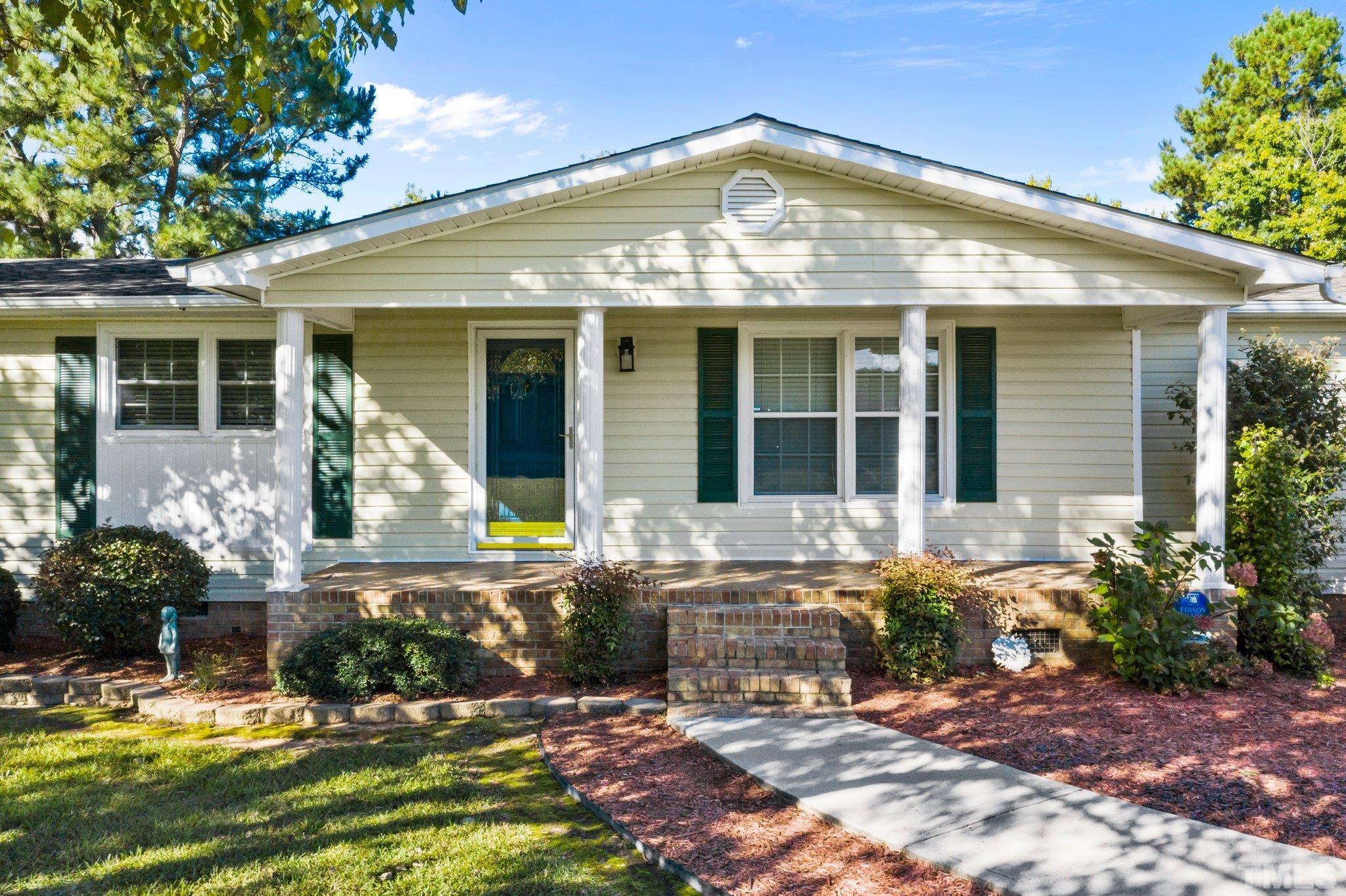 front view of a house with a yard