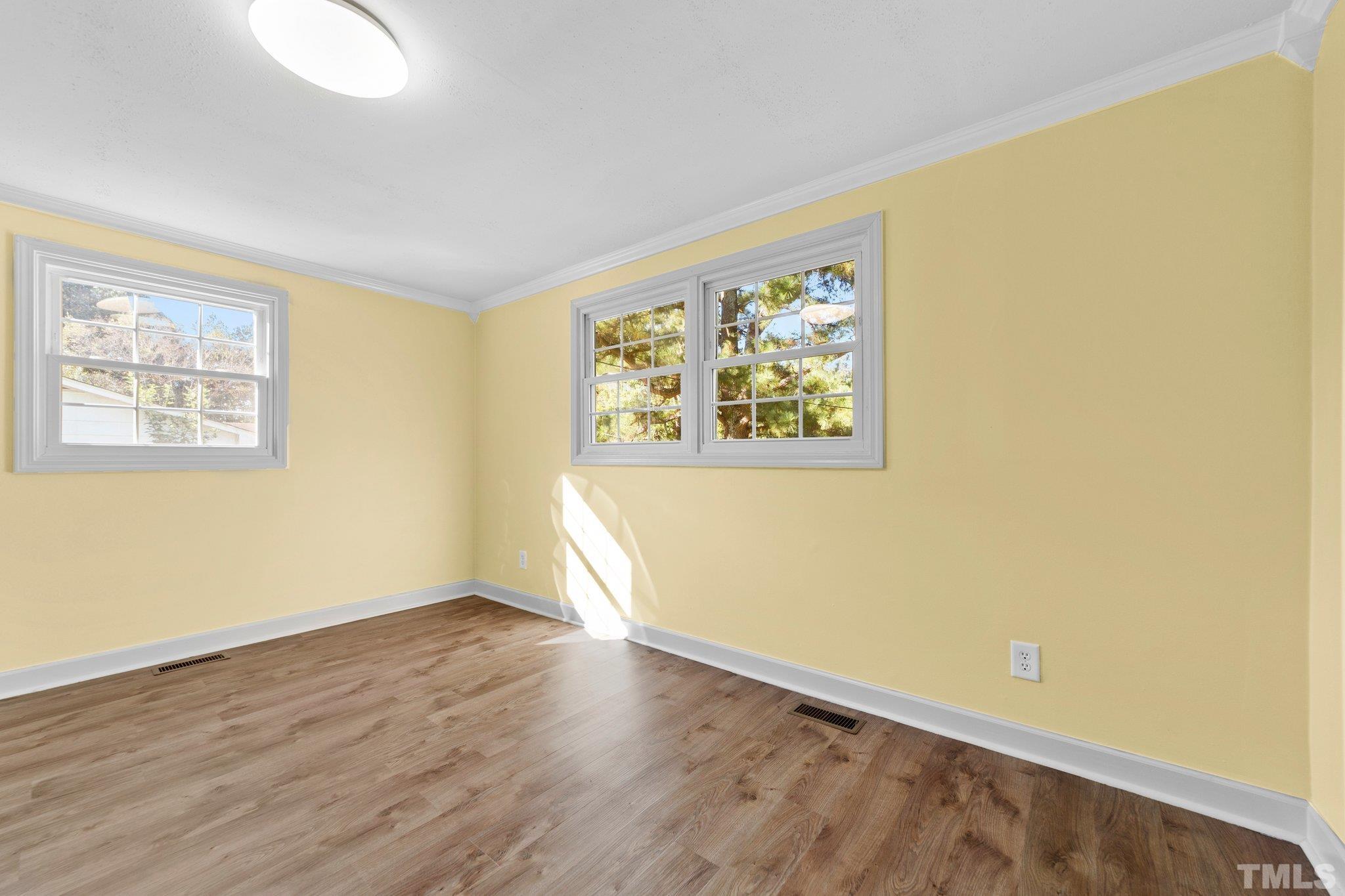 774 Abbott Road Henderson, NC 27537 - Photo 25 of 41 a view of an empty room with wooden floor and a window