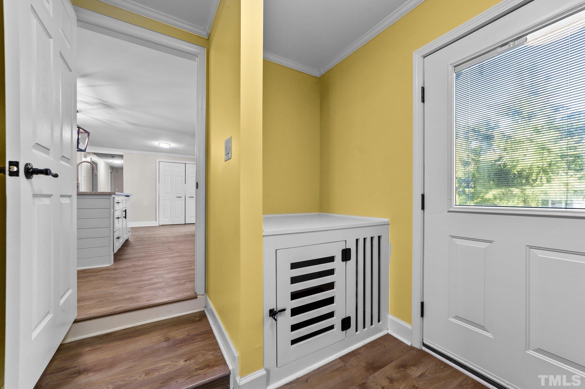 774 Abbott Road Henderson, NC 27537 - Photo 28 of 41 a view of a hallway with wooden floor and staircase