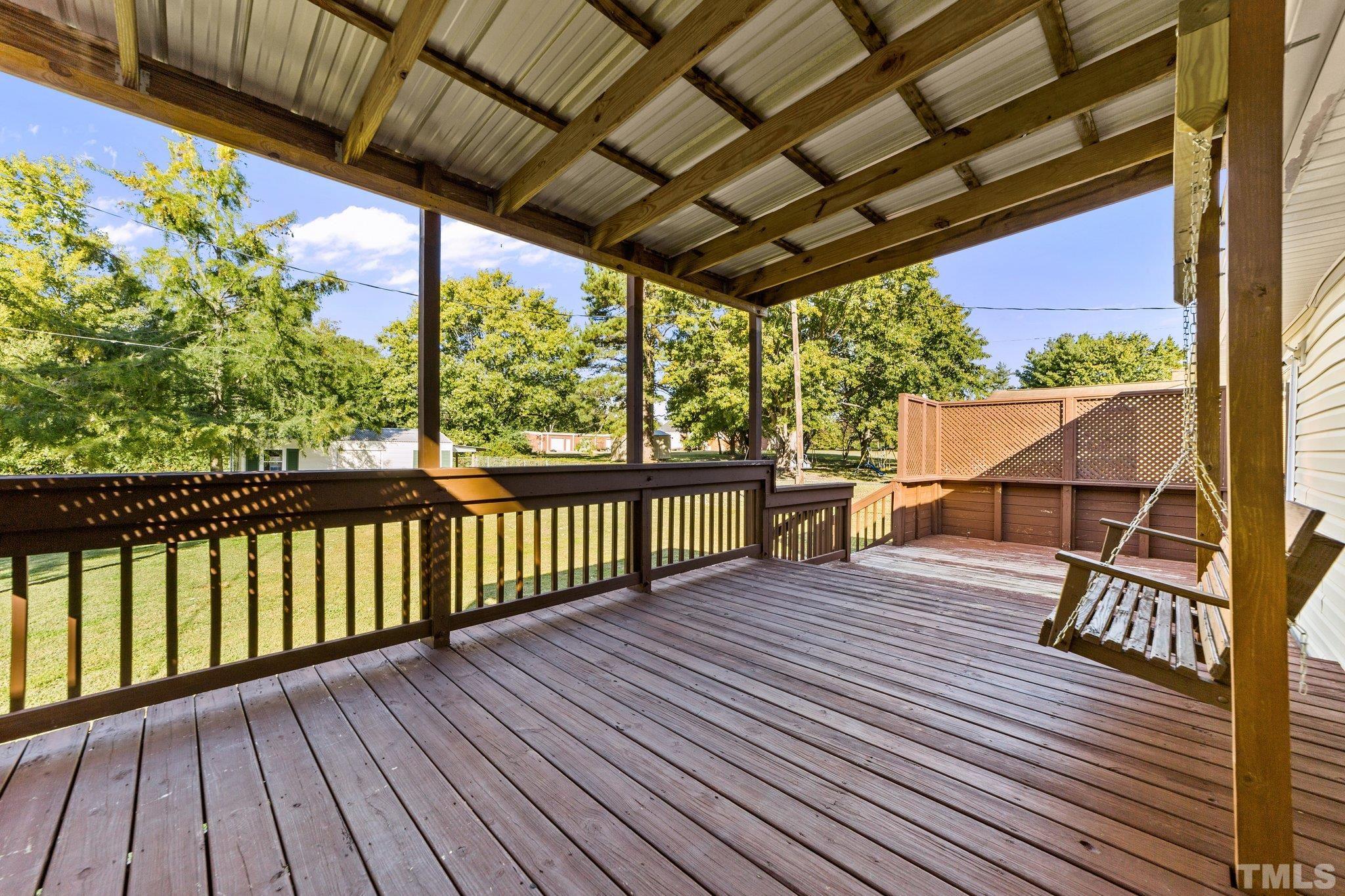 774 Abbott Road Henderson, NC 27537 - Photo 30 of 41 a view of a wooden deck
