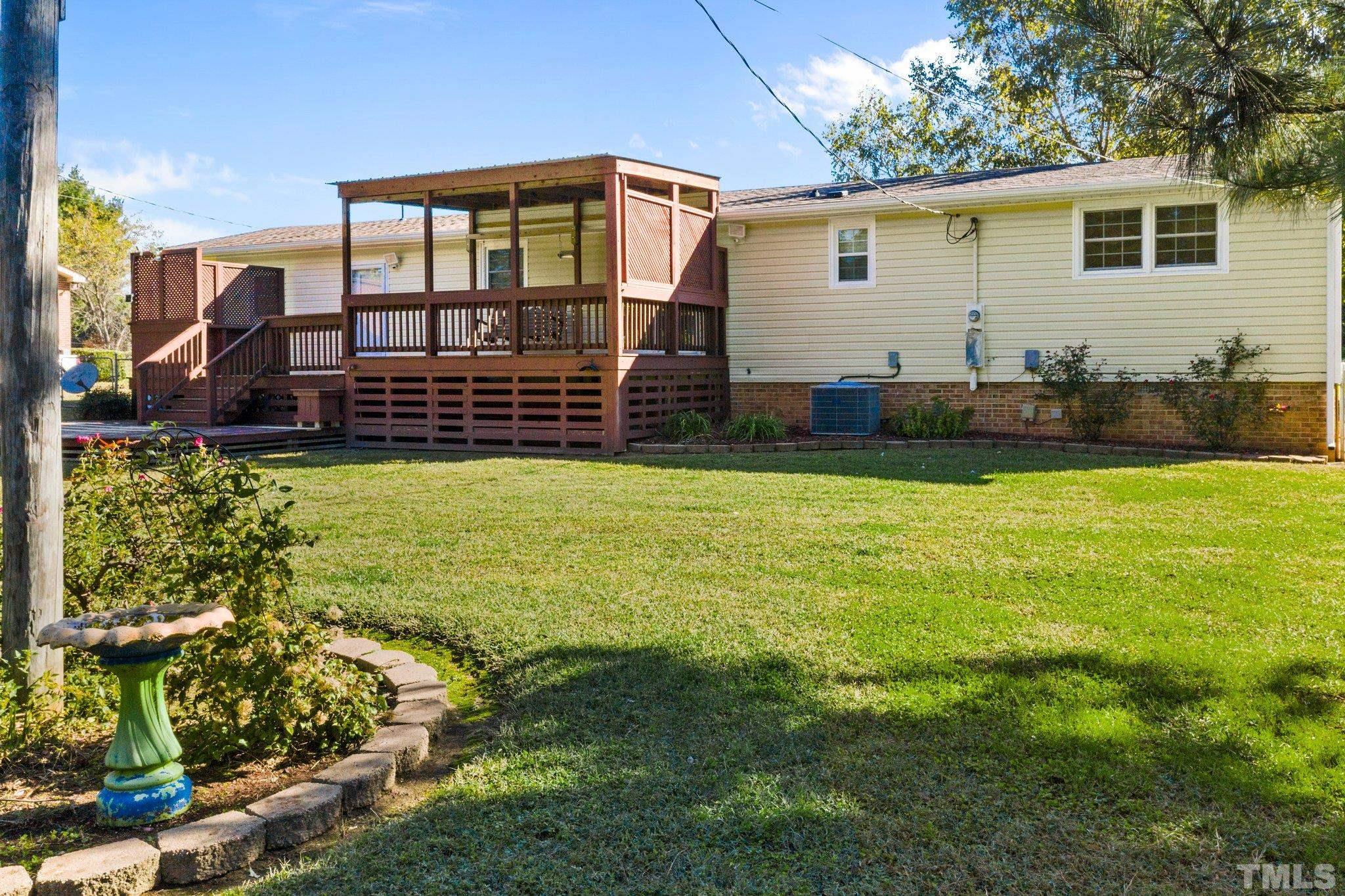 774 Abbott Road Henderson, NC 27537 - Photo 35 of 41 a view of a house with yard and sitting area
