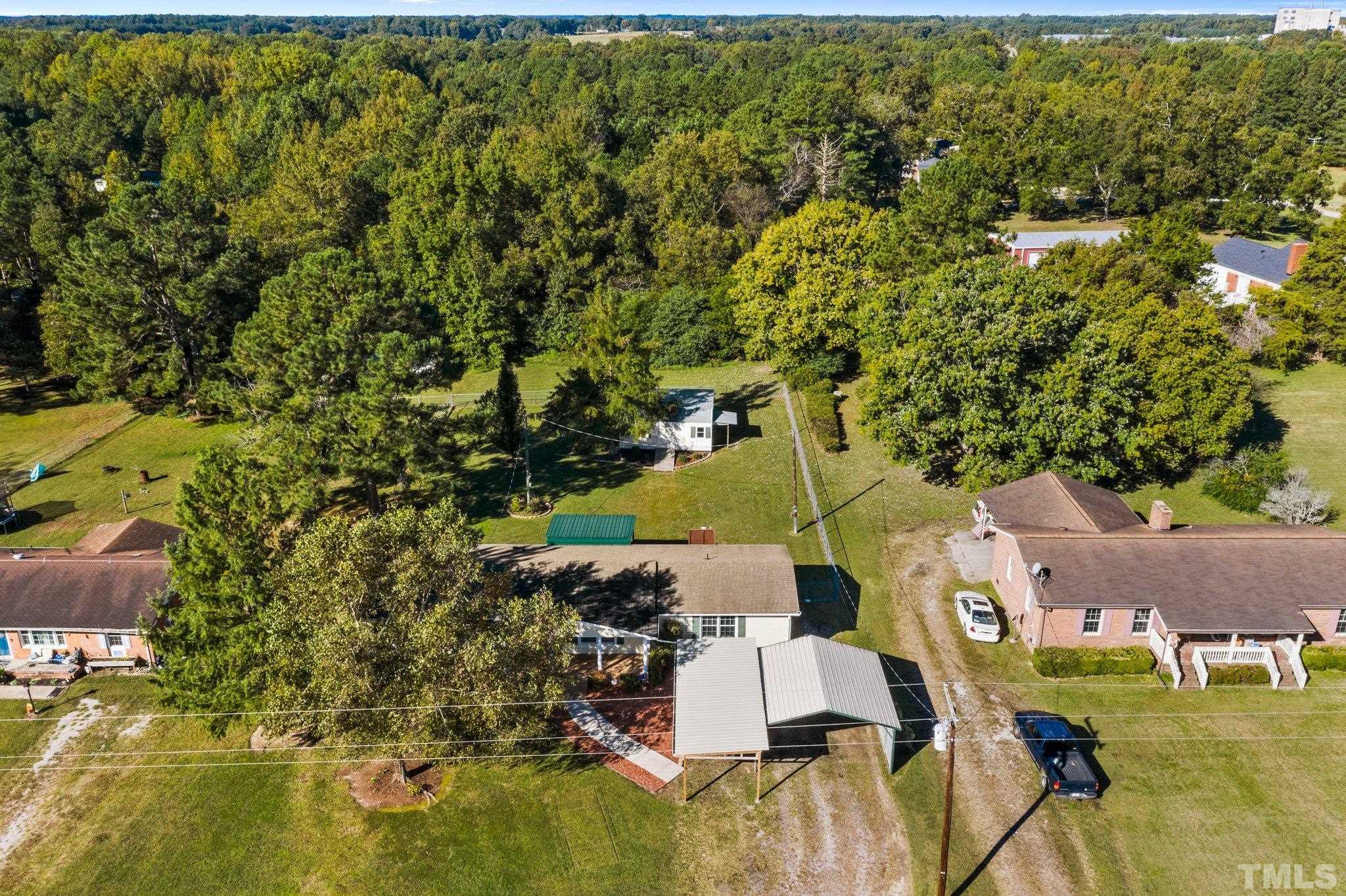 774 Abbott Road Henderson, NC 27537 - Photo 40 of 41 an aerial view of residential houses with outdoor space