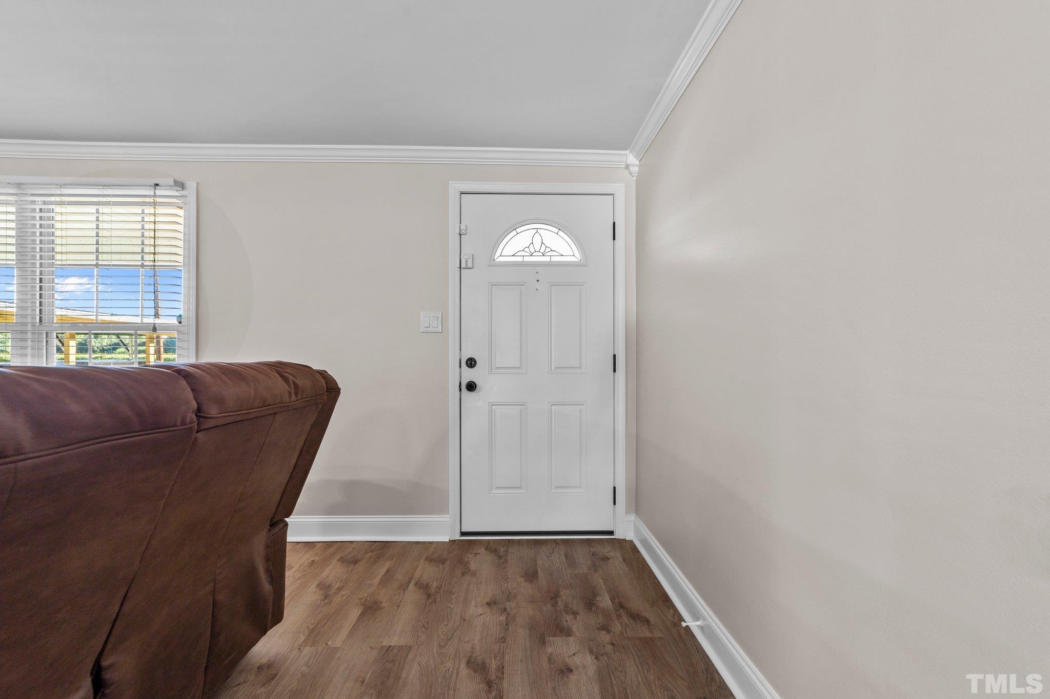 774 Abbott Road Henderson, NC 27537 - Photo 4 of 41 a view of a livingroom with a couch and a window