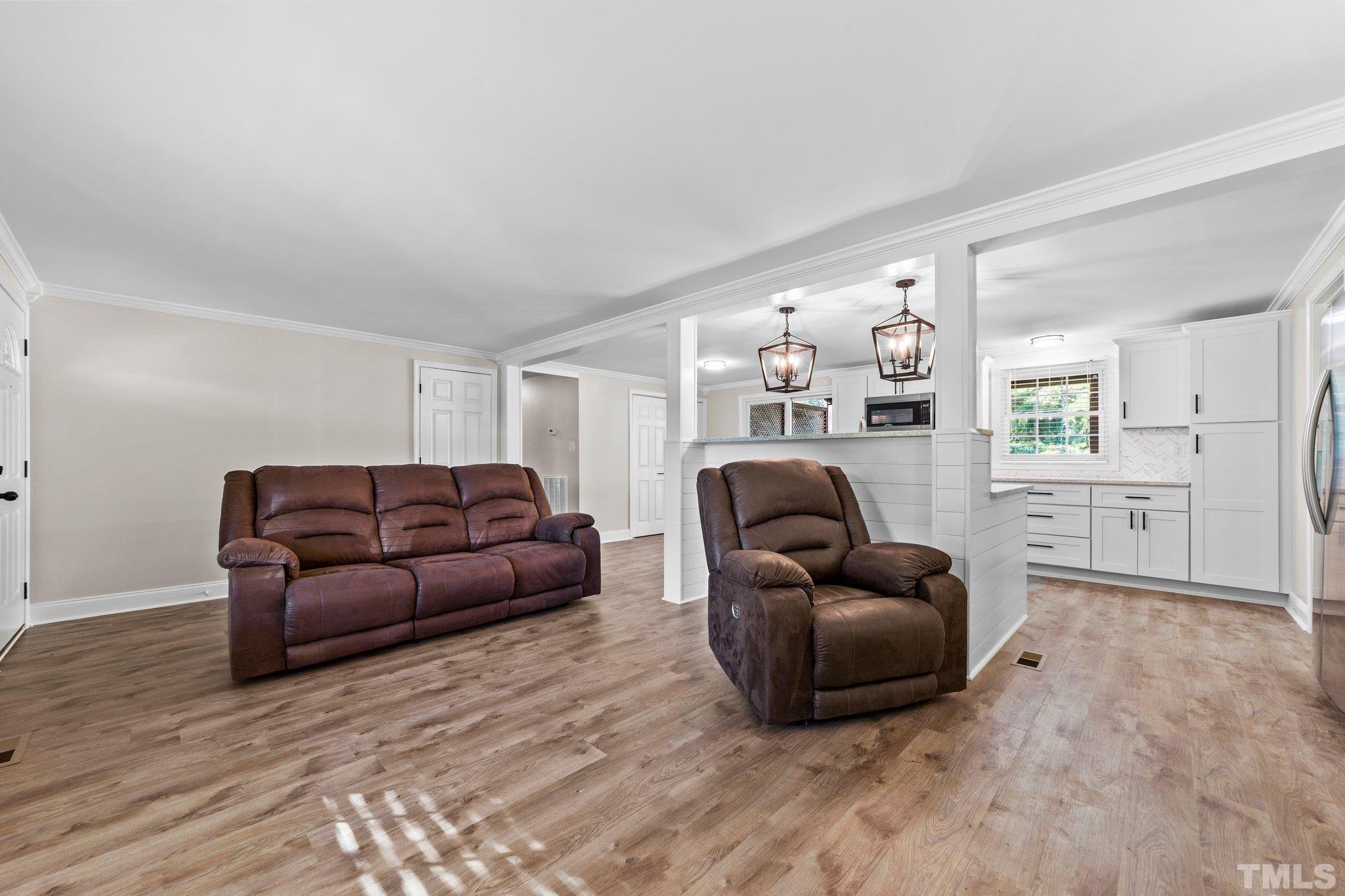 774 Abbott Road Henderson, NC 27537 - Photo 6 of 41 a living room with furniture and a couch
