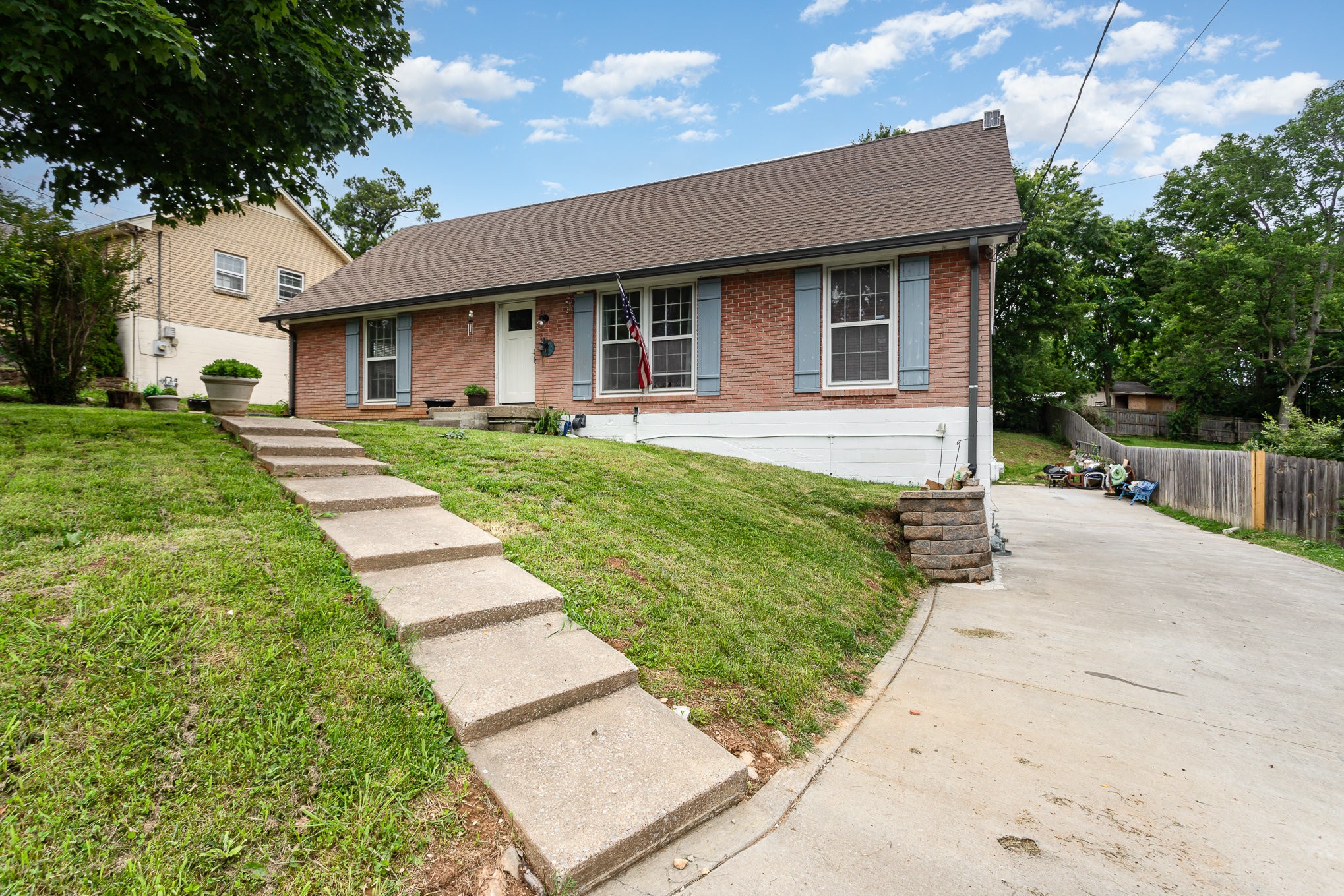 222 Wallace Road Nashville, TN 37211 - Photo 3 of 25 a front view of a house with a yard