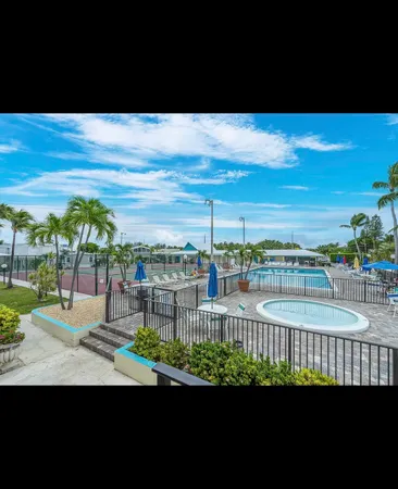 a view of swimming pool from a balcony