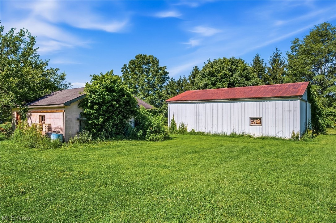 6890 Refugee Road Pickerington, OH 43147 - Photo 37 of 49 Expansive green lawn with two outbuildings