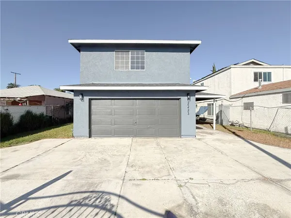 a view of house with garage