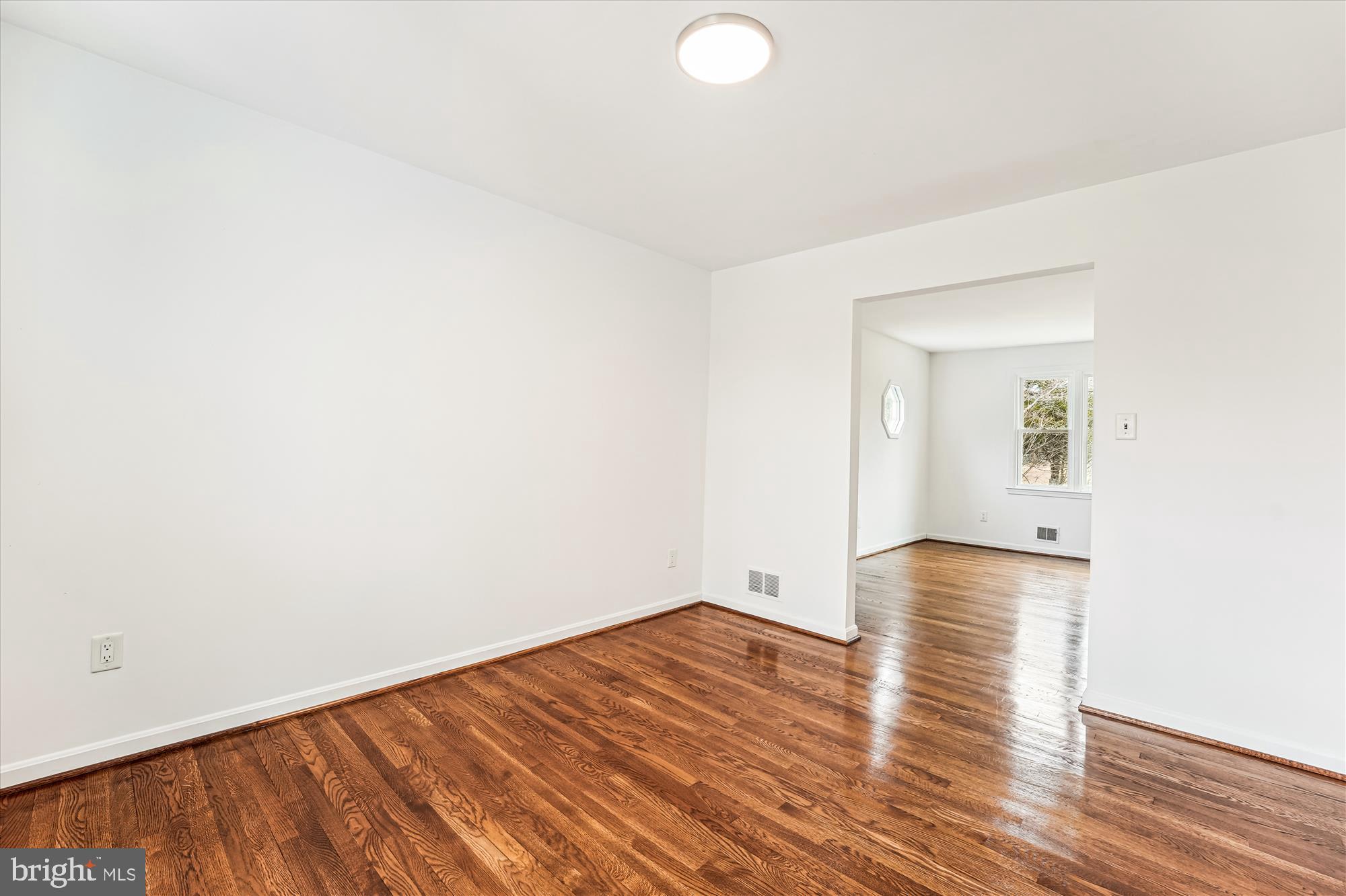8475 Wedding Drive Welcome, MD 20693 - Photo 16 of 48 a view of empty room with wooden floor