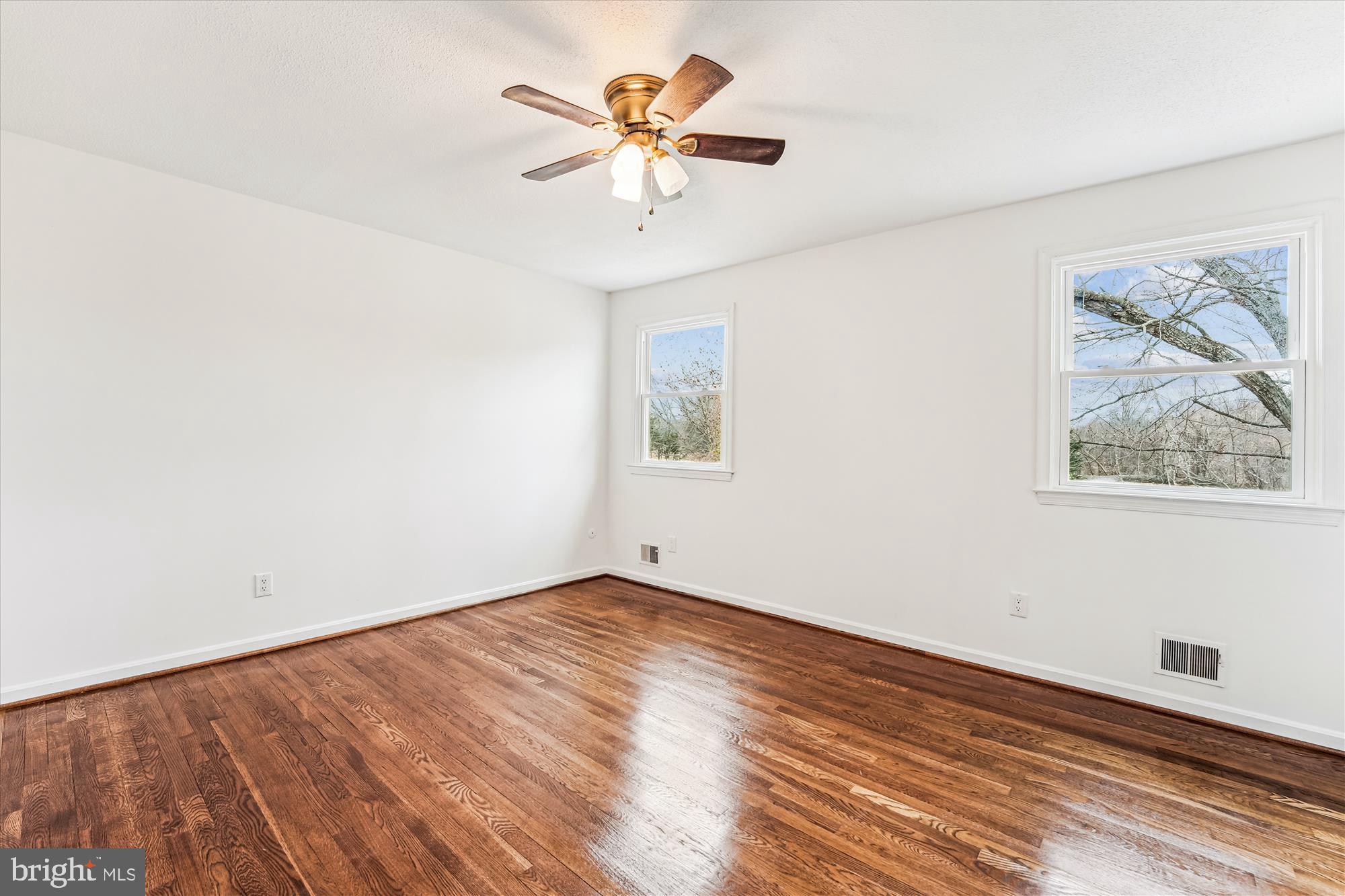 8475 Wedding Drive Welcome, MD 20693 - Photo 20 of 48 an empty room with a window and a ceiling fan