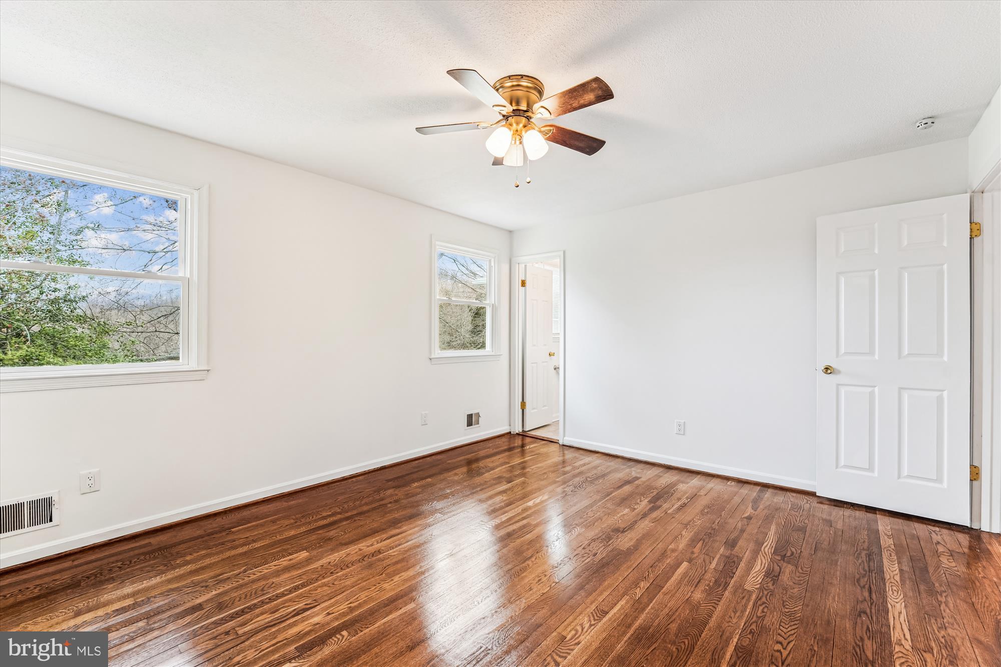 8475 Wedding Drive Welcome, MD 20693 - Photo 21 of 48 a view of an empty room with wooden floor and a window