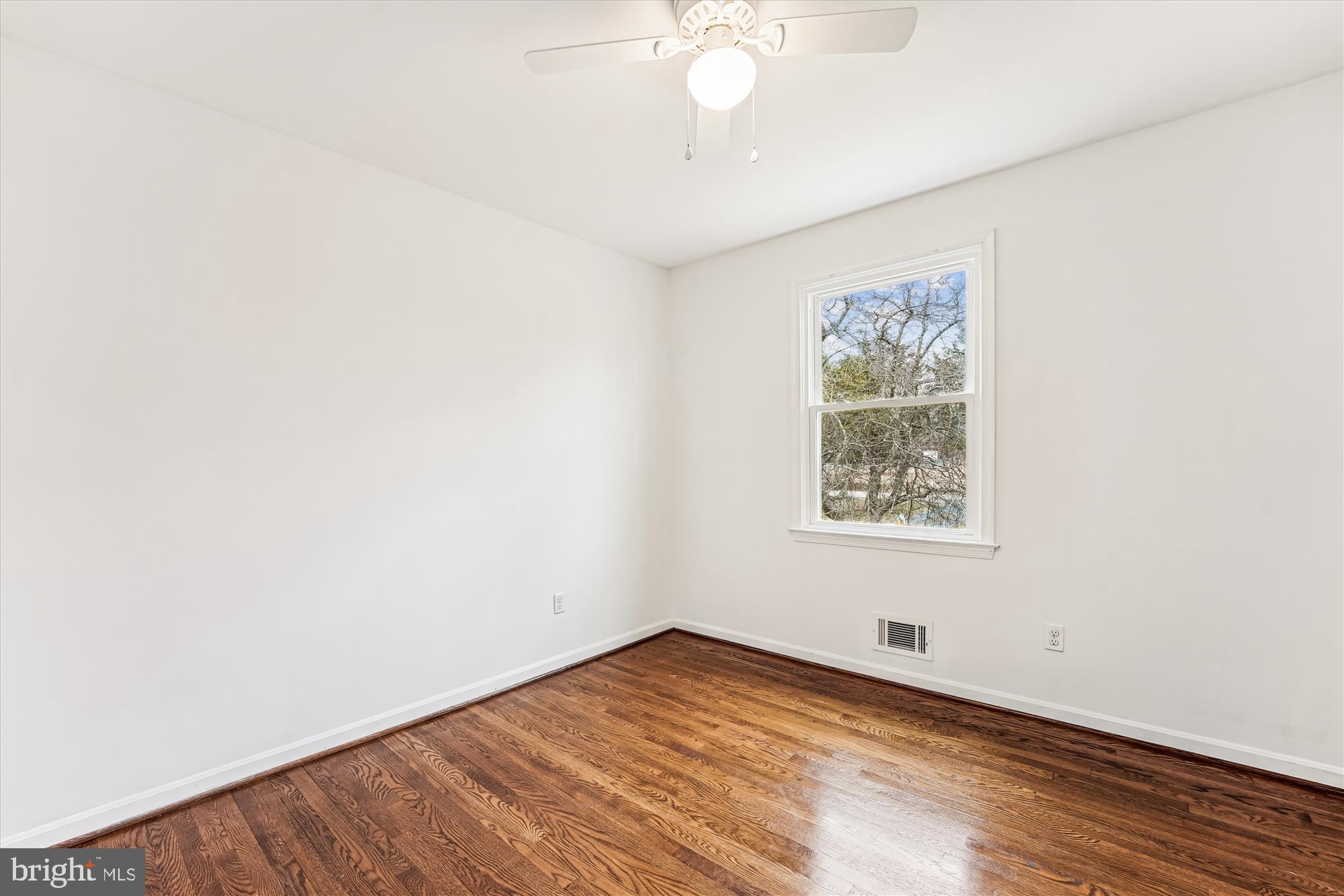 8475 Wedding Drive Welcome, MD 20693 - Photo 26 of 48 an empty room with wooden floor and windows