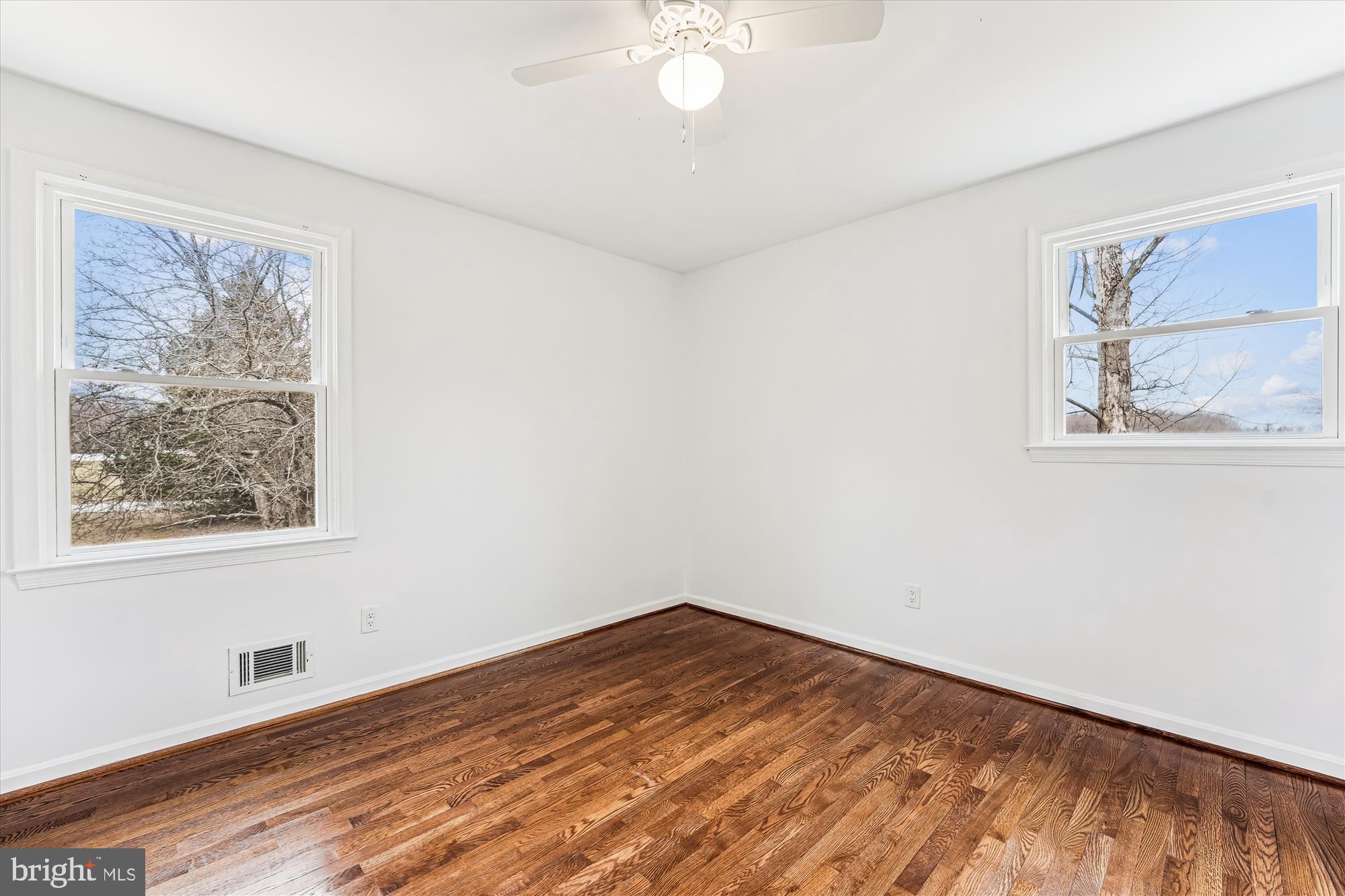 8475 Wedding Drive Welcome, MD 20693 - Photo 29 of 48 a view of empty room with wooden floor and fan