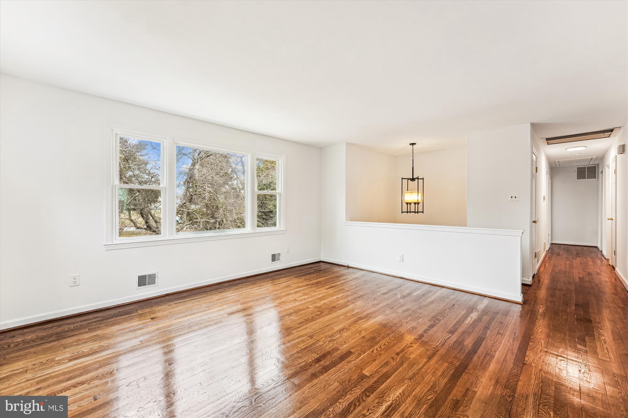 8475 Wedding Drive Welcome, MD 20693 - Photo 5 of 48 an empty room with wooden floor and windows