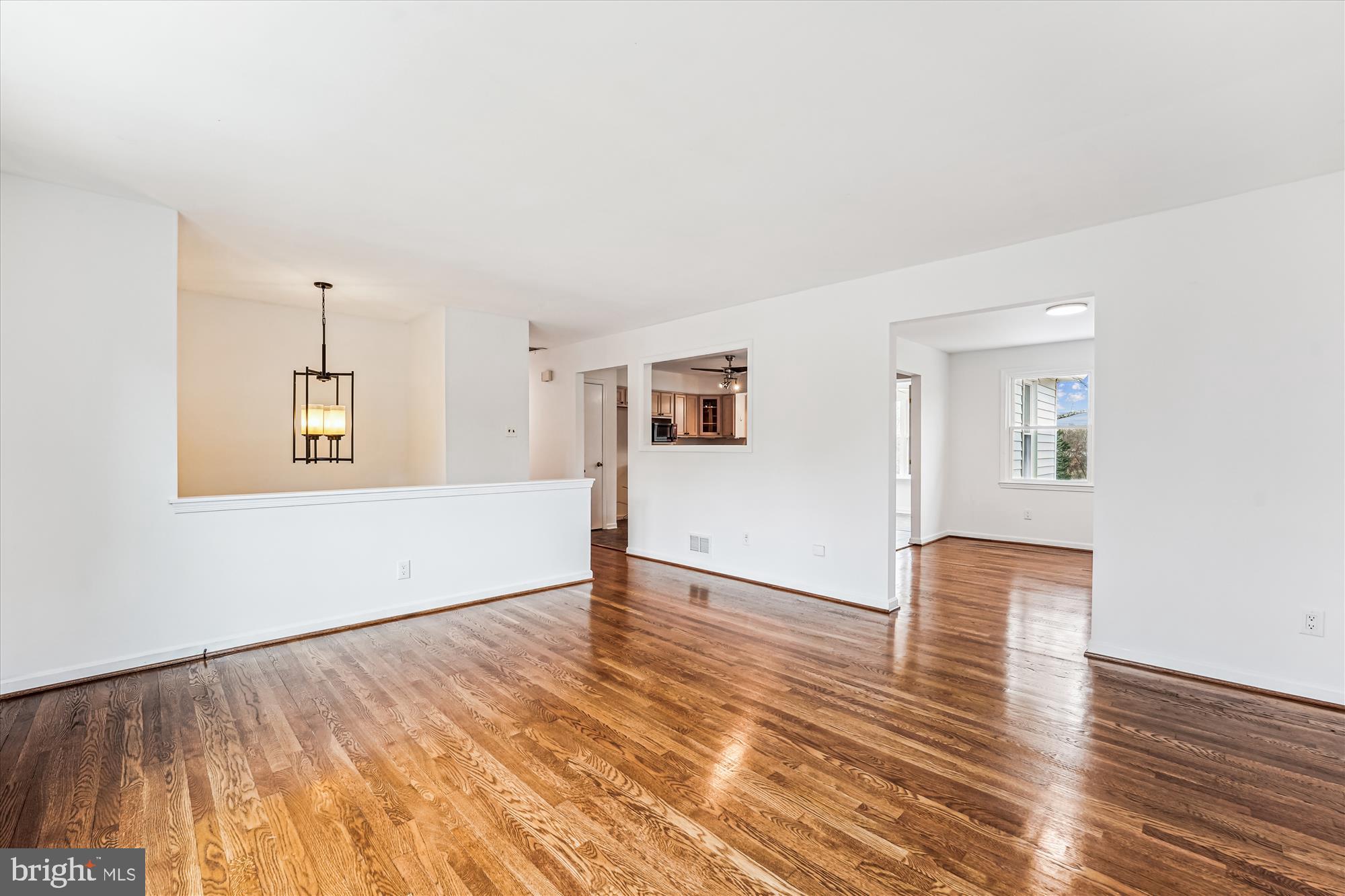 8475 Wedding Drive Welcome, MD 20693 - Photo 6 of 48 a view of an empty room with wooden floor and a window
