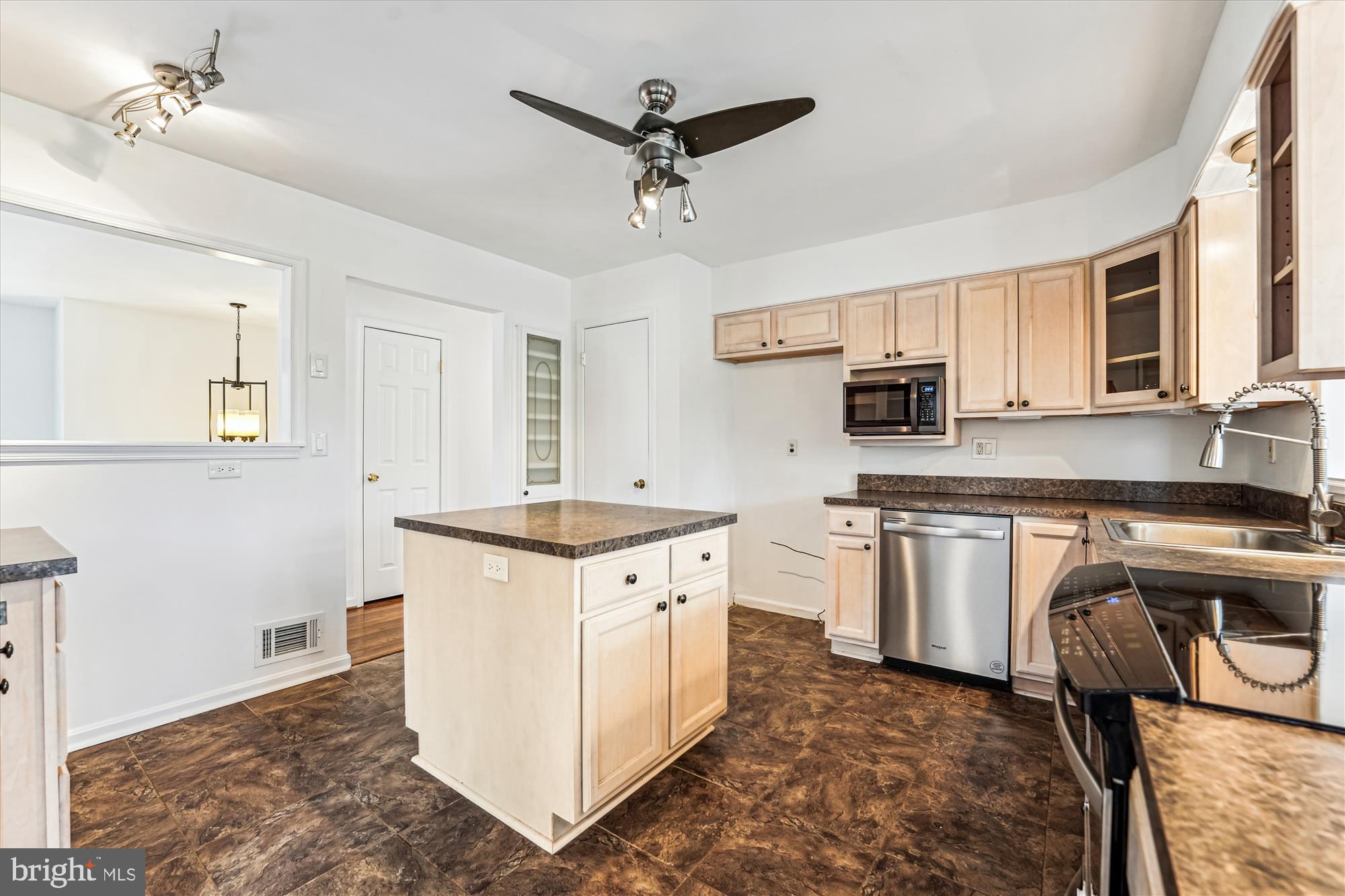 8475 Wedding Drive Welcome, MD 20693 - Photo 10 of 48 a kitchen with stainless steel appliances granite countertop a sink stove and refrigerator