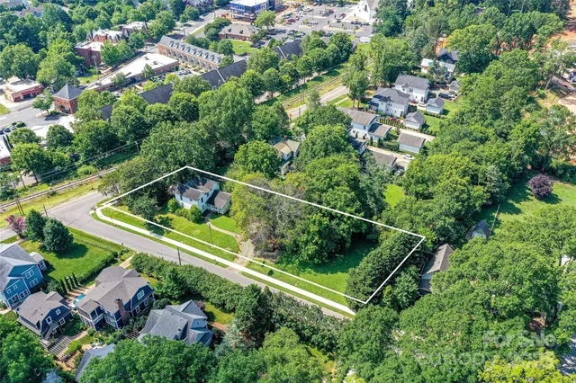 an aerial view of residential house with outdoor space and swimming pool