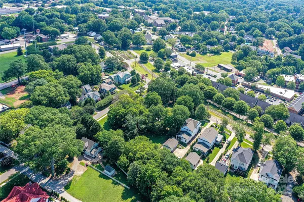 an aerial view of residential house with swimming pool and outdoor space