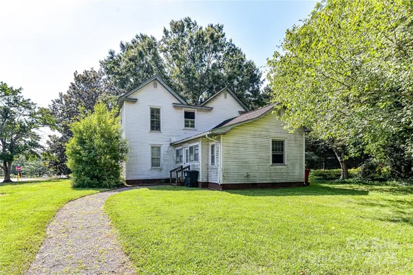 a house with trees in the background