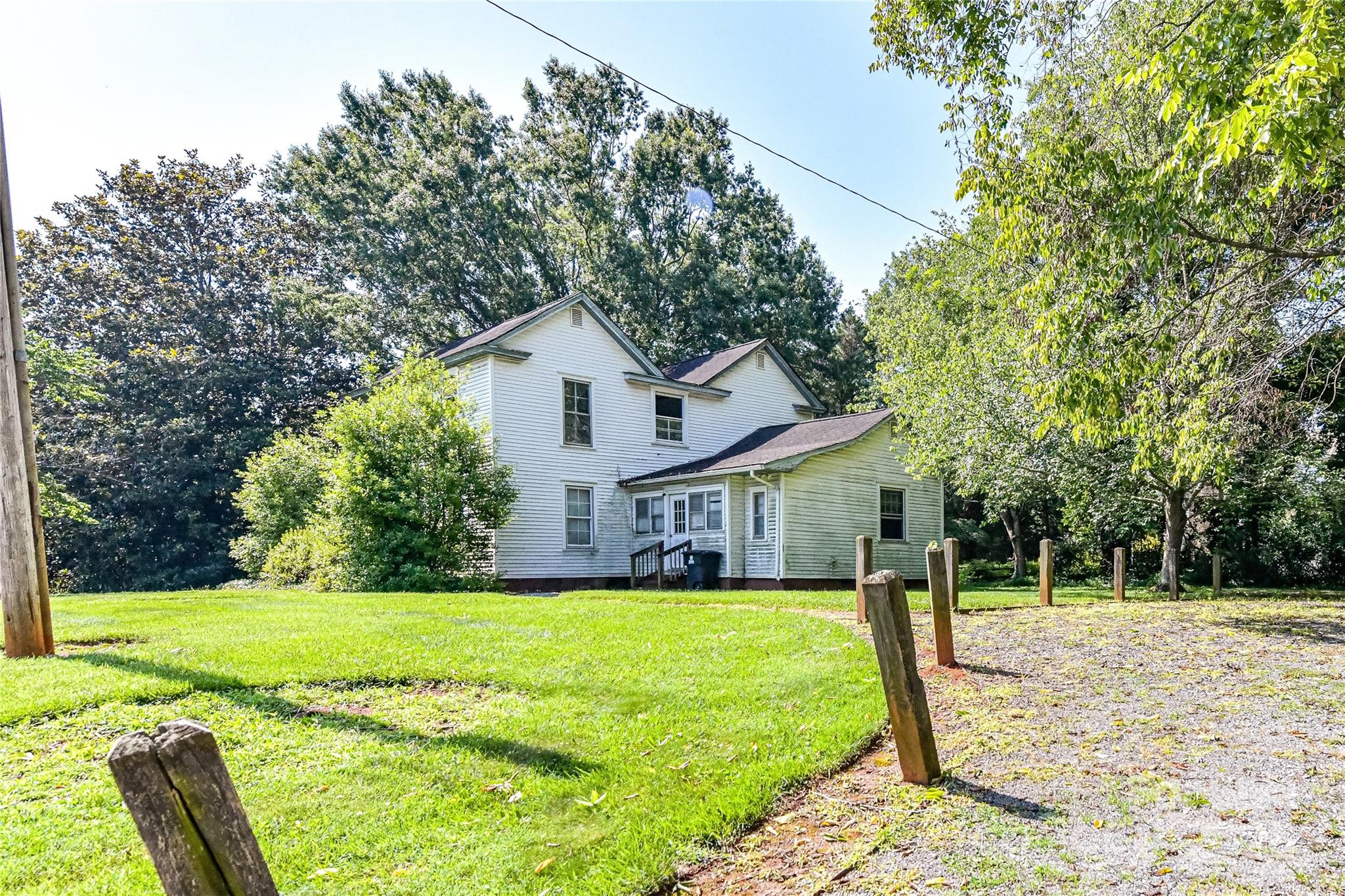 504 Potts Street Davidson, NC 28036 - Photo 6 of 34 a view of a house with a big yard and potted plants