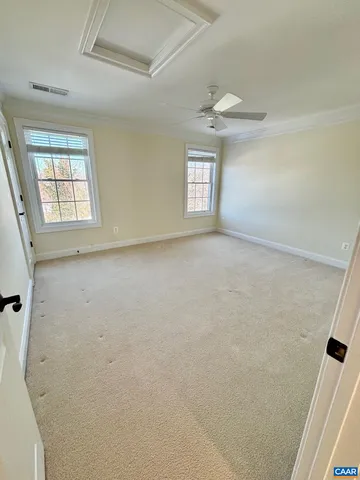 an empty room with windows and entrance