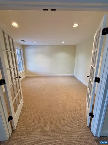 a view of an empty room with stairs