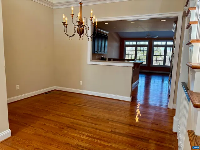 a view of a living room and wooden floor