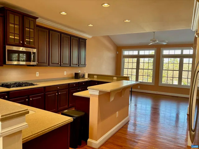 a kitchen that has a sink and a stove in it