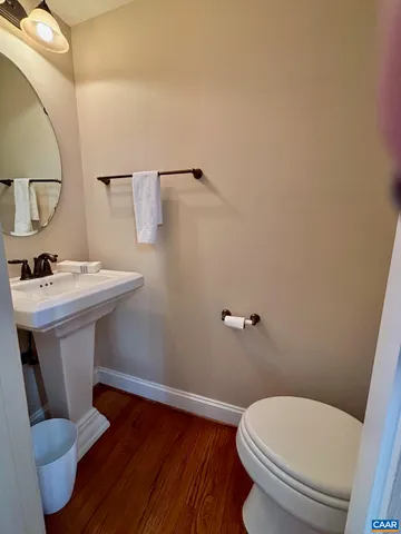 a white toilet sitting next to a bathroom sink