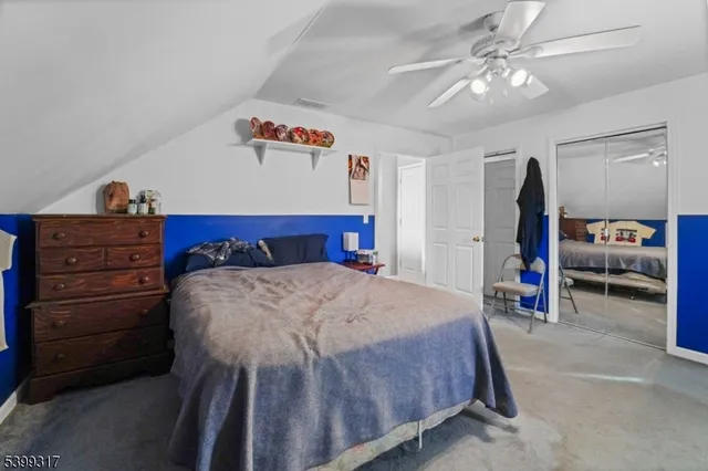 a bed room with a bed and a chandelier