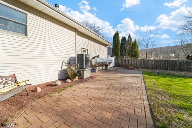 a view of a backyard with sitting area