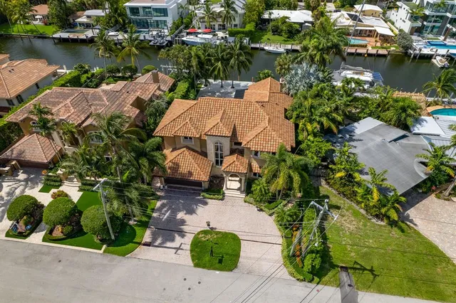 an aerial view of a house with a lake view