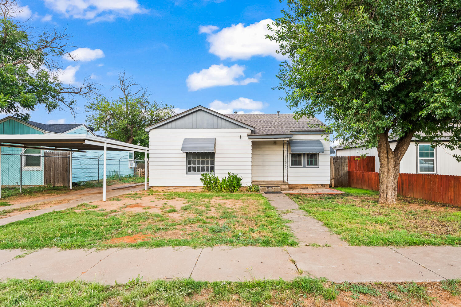 111 Avenue U Lubbock, TX 79415 - Photo 1 of 17 a front view of a house with a yard and garage