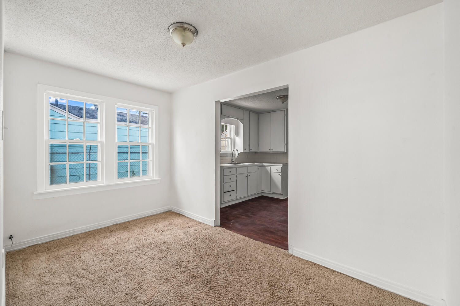 111 Avenue U Lubbock, TX 79415 - Photo 11 of 17 an empty room with windows