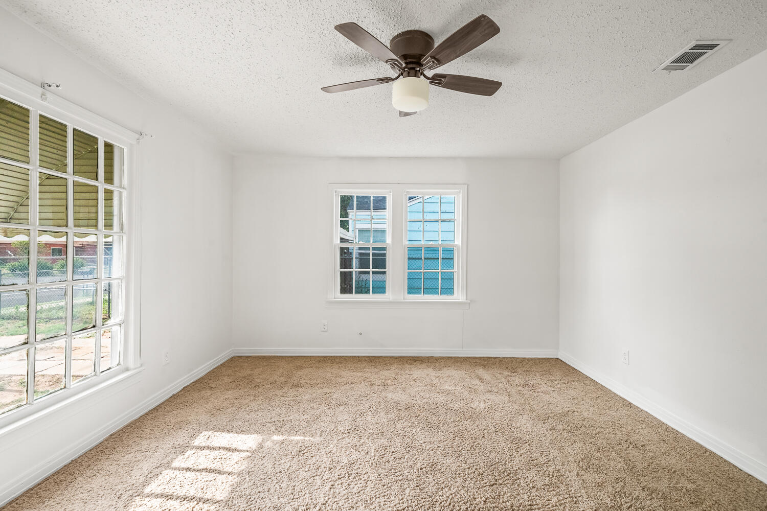 111 Avenue U Lubbock, TX 79415 - Photo 12 of 17 an empty room with a window