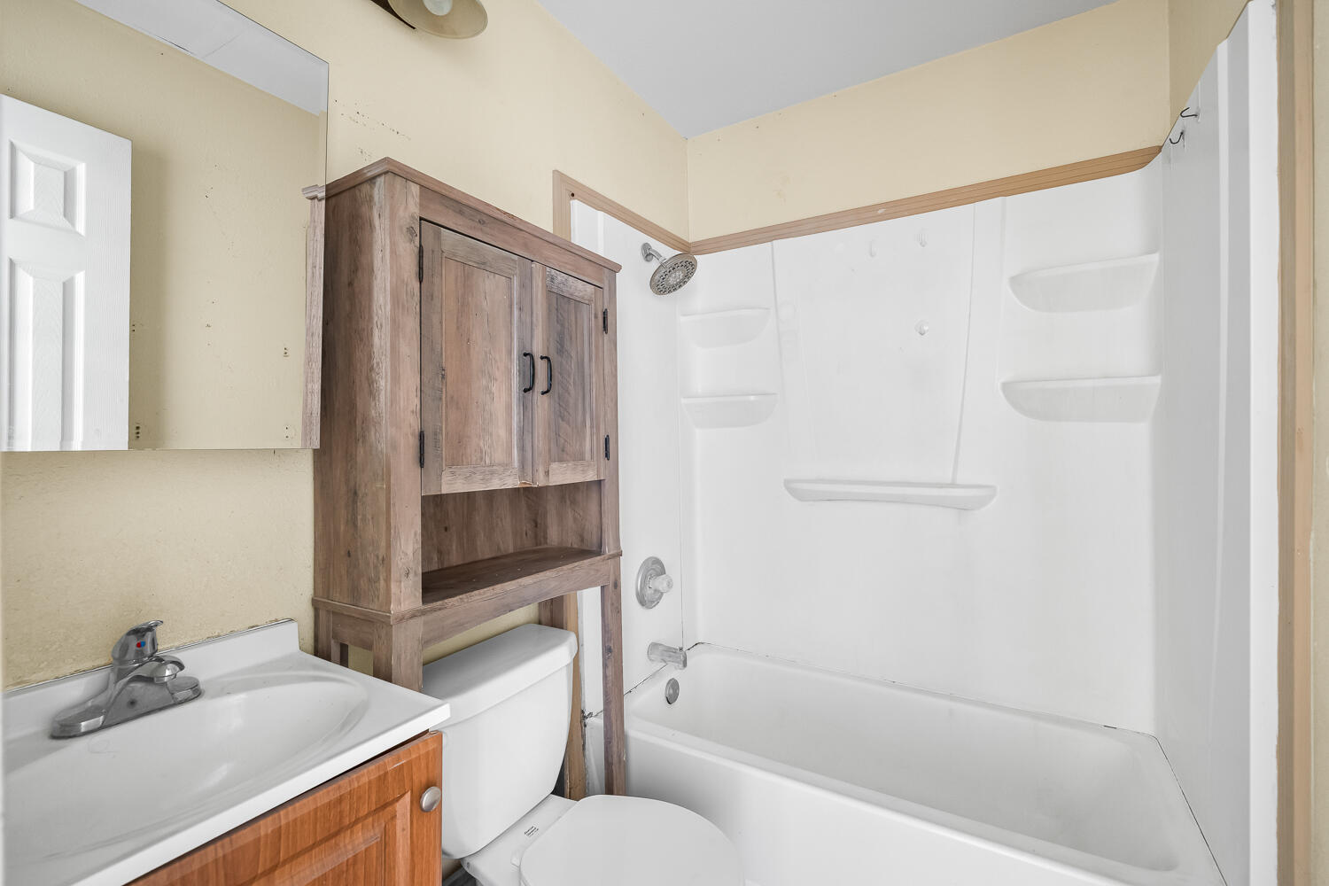 111 Avenue U Lubbock, TX 79415 - Photo 14 of 17 a bathroom with a sink toilet and shower