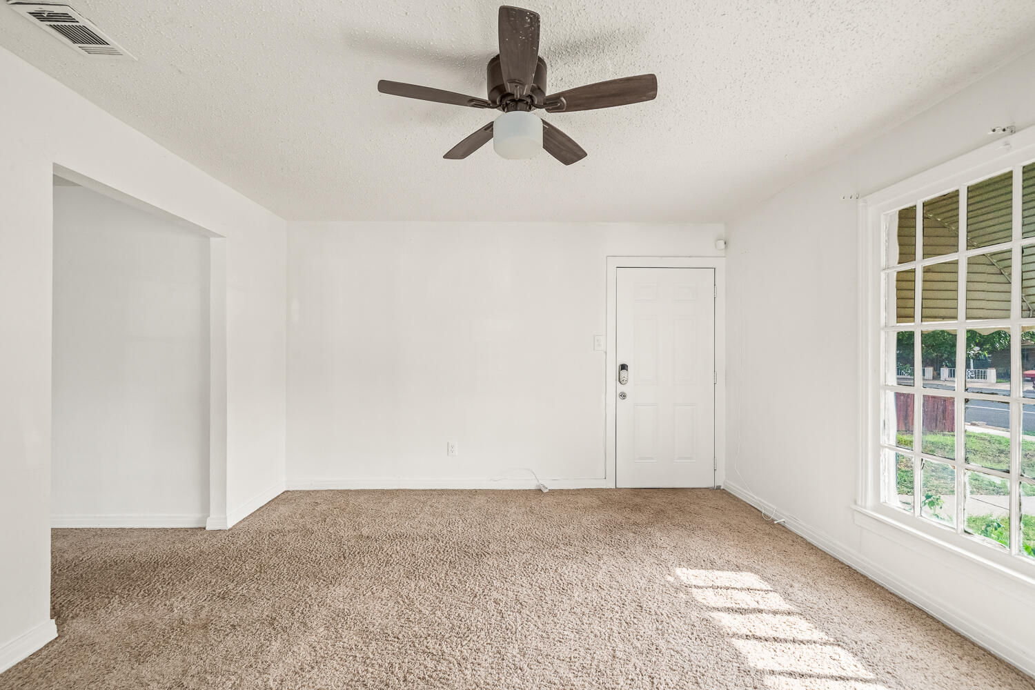 111 Avenue U Lubbock, TX 79415 - Photo 15 of 17 a view of a livingroom with a ceiling fan and window