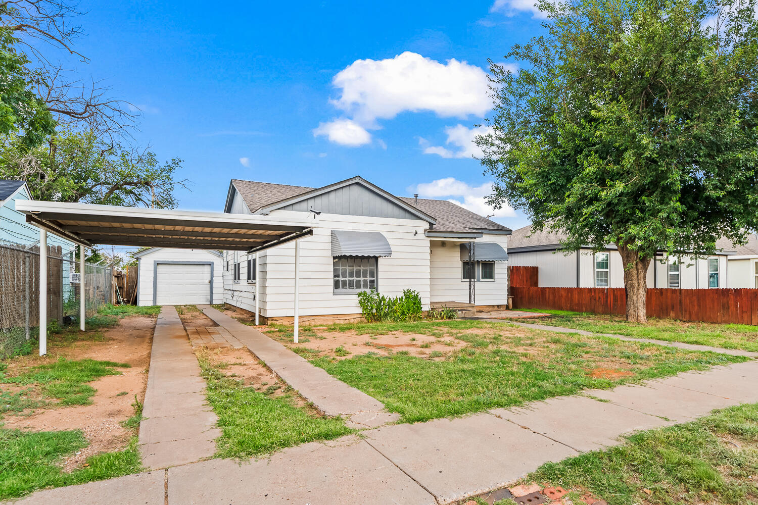 111 Avenue U Lubbock, TX 79415 - Photo 2 of 17 a front view of a house with a yard and porch
