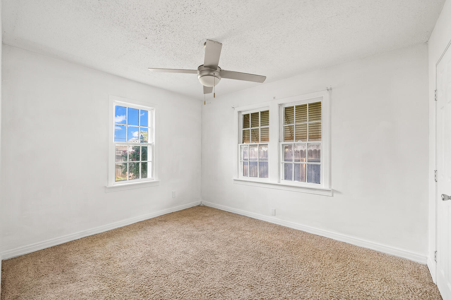 111 Avenue U Lubbock, TX 79415 - Photo 6 of 17 an empty room with windows