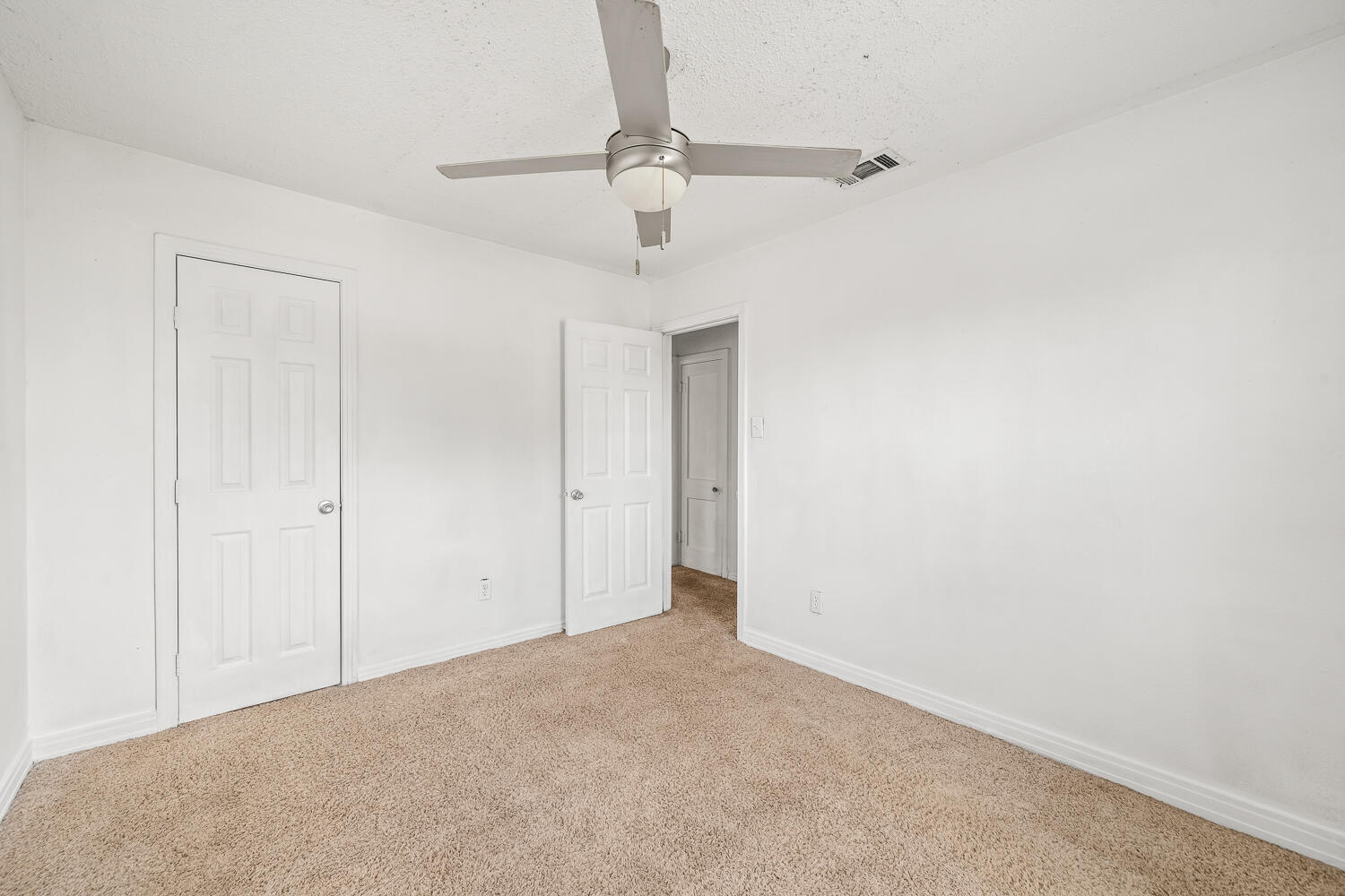 111 Avenue U Lubbock, TX 79415 - Photo 7 of 17 a view of a room with a ceiling fan