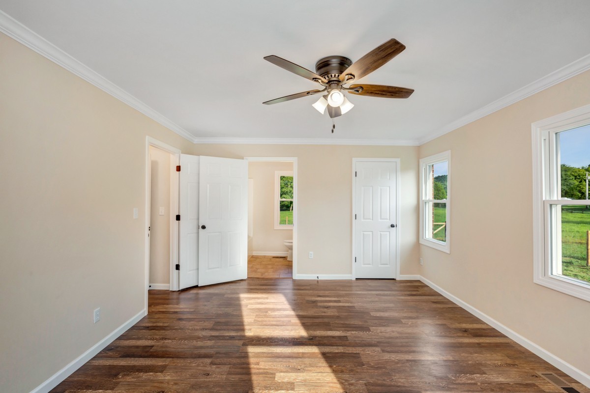 477 Holt Hollow Road Prospect, TN 38477 - Photo 18 of 34 a view of an empty room with window and wooden floor