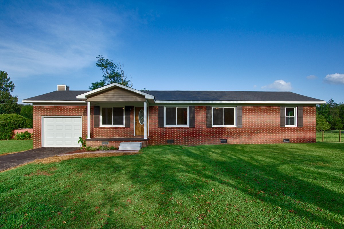 477 Holt Hollow Road Prospect, TN 38477 - Photo 2 of 34 a front view of a house with a yard