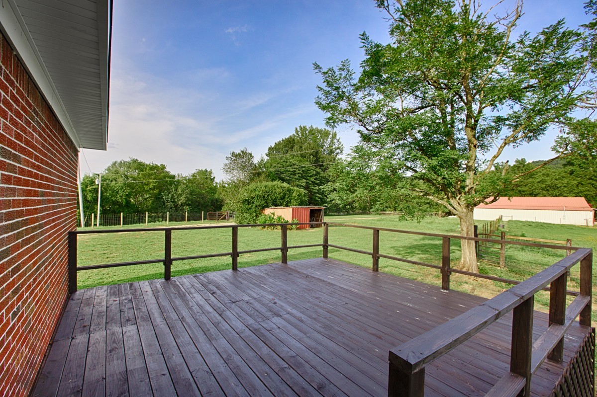 477 Holt Hollow Road Prospect, TN 38477 - Photo 21 of 34 a view of wooden deck with a yard