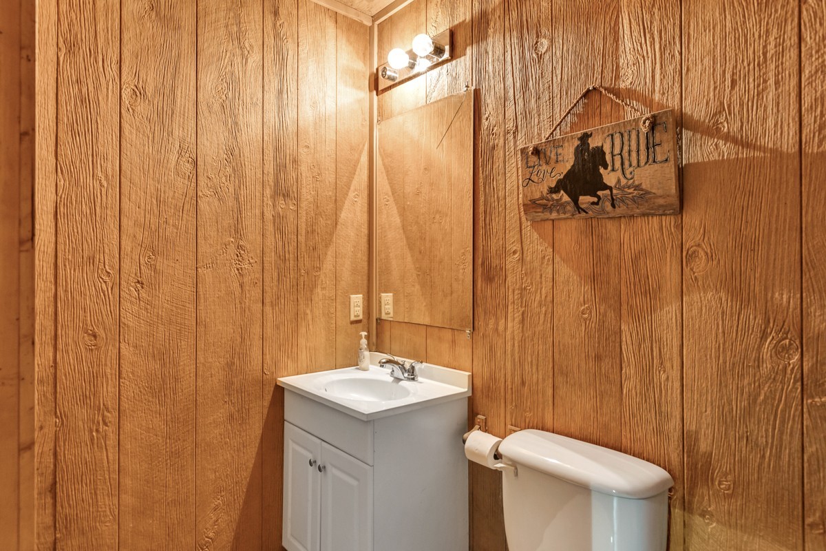 477 Holt Hollow Road Prospect, TN 38477 - Photo 28 of 34 a bathroom with a sink a toilet and shower curtain