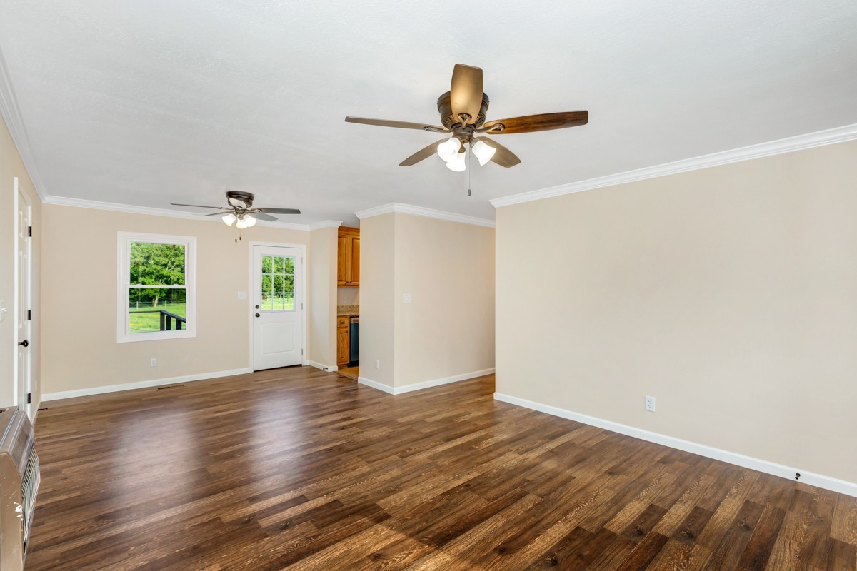 477 Holt Hollow Road Prospect, TN 38477 - Photo 5 of 34 wooden floor in an empty room with a window