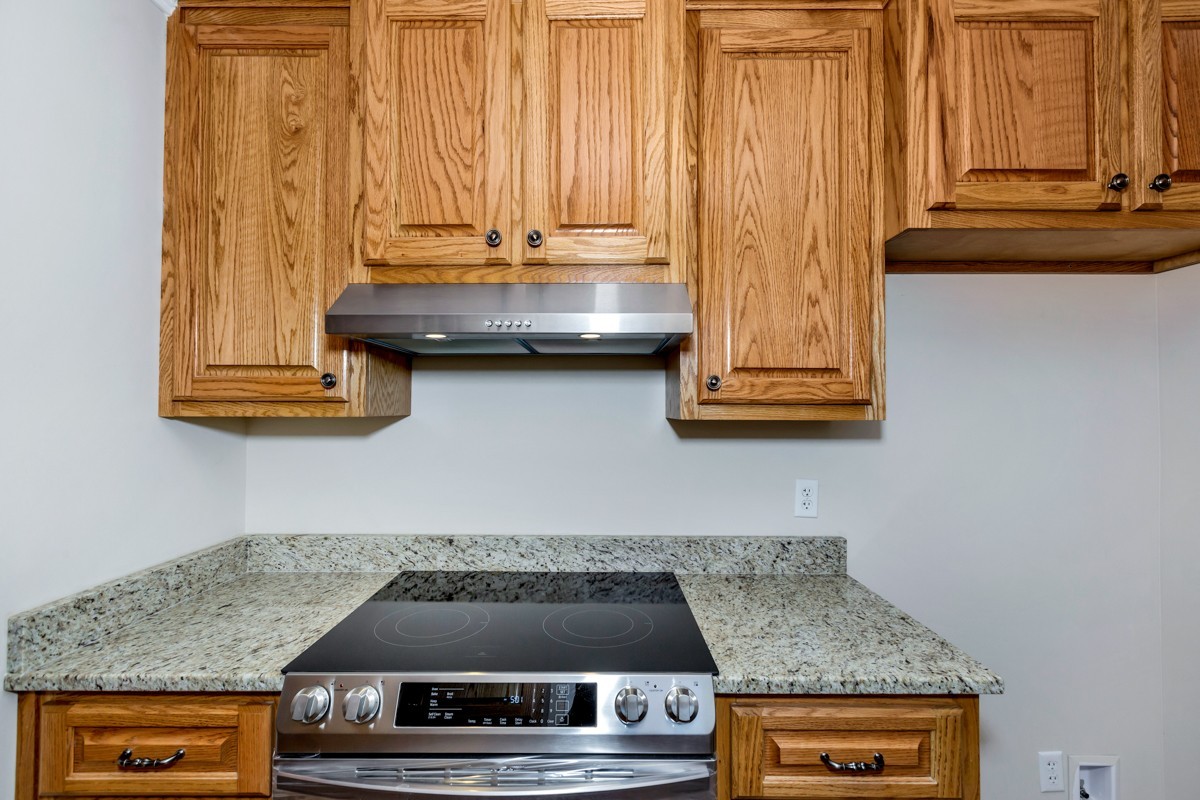 477 Holt Hollow Road Prospect, TN 38477 - Photo 10 of 34 a kitchen with a stove and a microwave