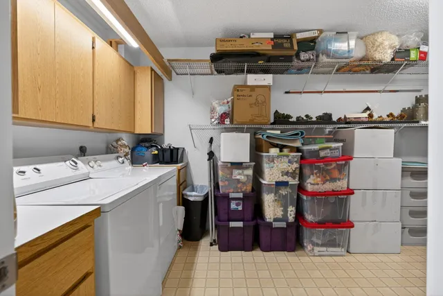 a utility room with cabinets