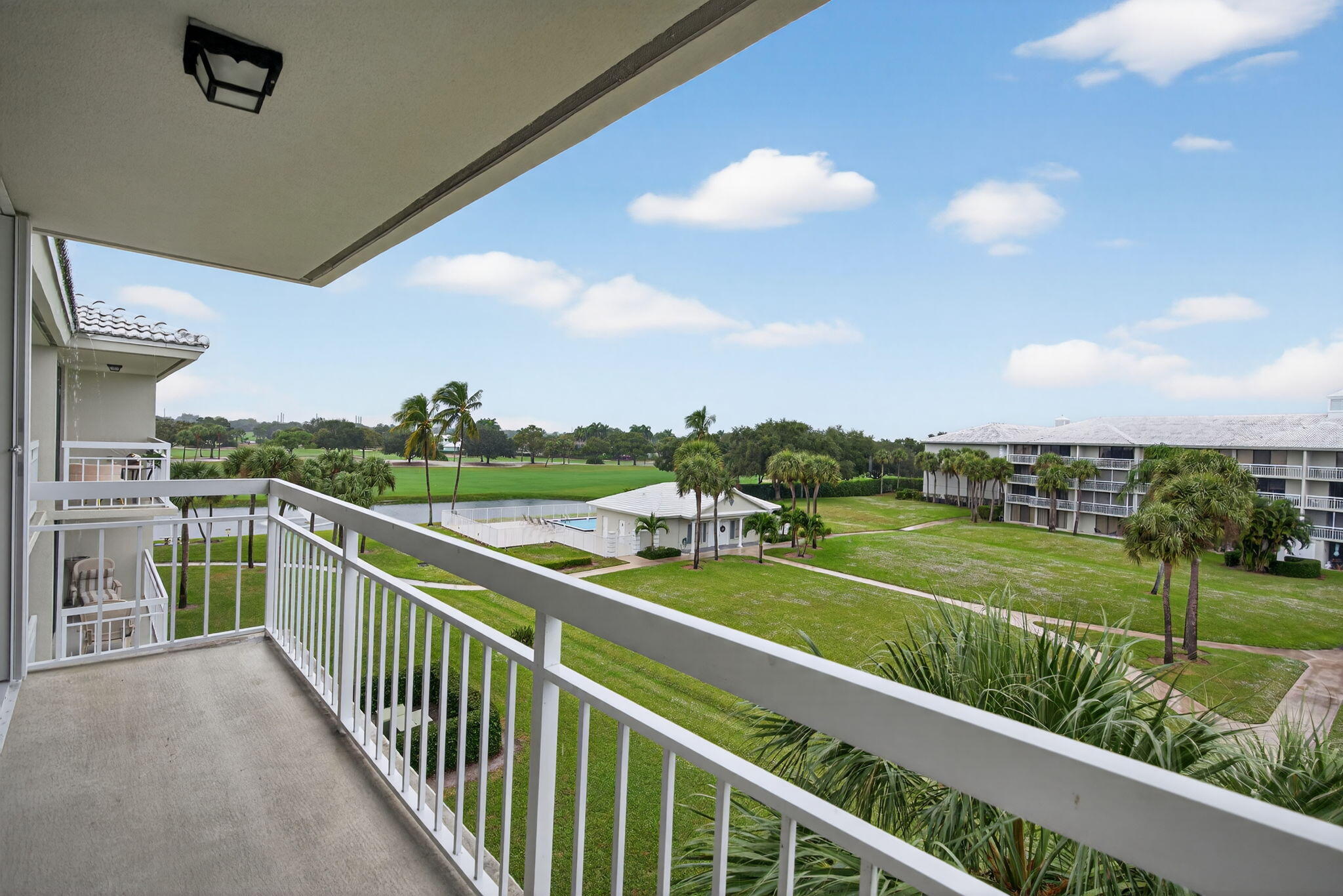2441 Village Boulevard, Unit 405 West Palm Beach, FL 33409 - Photo 20 of 24 a view of a balcony with city view