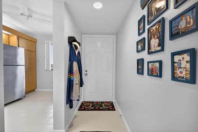 a view of an entryway with wooden floor